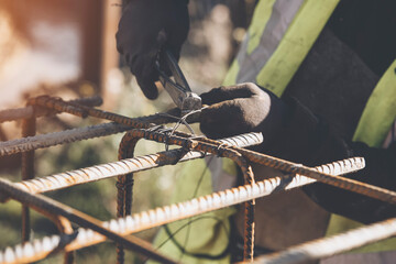 Steel reinforcement re-bars for a monolithic concrete frame. Construction site industrial...