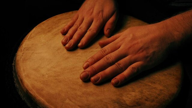 Hand Drumming Musician On Large Drum
