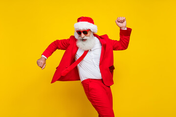 Portrait of handsome overjoyed person have good mood dancing chilling isolated on yellow color background