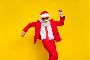 Fototapeta na wymiar Photo of cool attractive santa dressed red suit tie dancing having fun discotheque isolated yellow color background