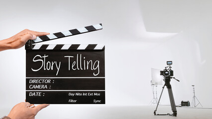 Story telling, Handwriting on film slate or clapperboard .film crew holding film clapperboard and a...