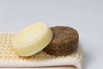 Solid shampoos for hair care. Natural handmade cosmetics made from oils and plants.