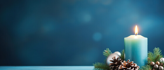 Christmas - Banner Of 1 candle and xmas ornament, Pine-cones And green Spruce Branches minimal blue background and lights in the back, with empty copy space
