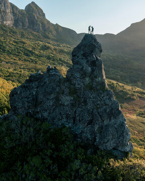 Aerial view of people climbing on Piton Jacob Peak mountain in Port Louis, Mauritius.