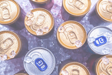 Group of aluminium cans in ice, cold drink.