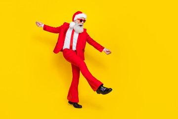 Fototapeta na wymiar Full body portrait of crazy overjoyed person enjoy dancing x-mas eve event isolated on yellow color background