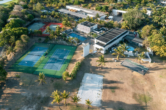Aerial view of tennis courtyards of a luxury resort in Long Beach, Poste de Flacq, Flacq district, Mauritius.