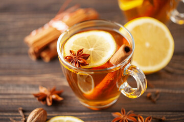 Spiced drink cocktail for New Year, Christmas, winter or autumn holidays. Hot Toddy. - obrazy, fototapety, plakaty