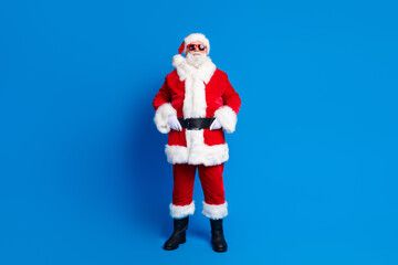 Full body photo of retired old man touch belt defile shopping wear trendy santa claus costume coat isolated on blue color background