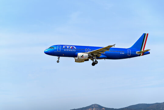 Barcelona, ​​Spain; April 10, 2023: Airbus A320 plane of the Ita Airways company, landing at the Josep Tarradellas Barcelona-El Prat airport	
