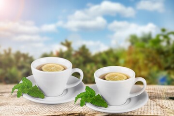 Cold tasty tea in cups on the desk