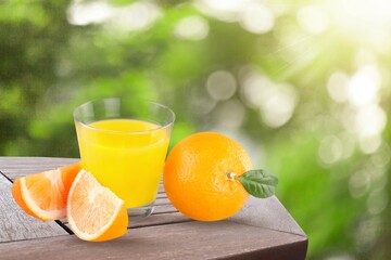 Fresh sweet orange juice in glass on table