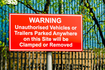 No Parking sign, indicating cars will be clamped and towed away