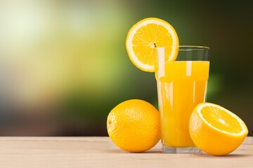 Fresh sweet orange juice in glass on table