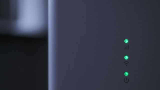 Wi-fi router blinking lights red and green, turning on 4g modem for internet connection, macro detail for background or wallpaper video