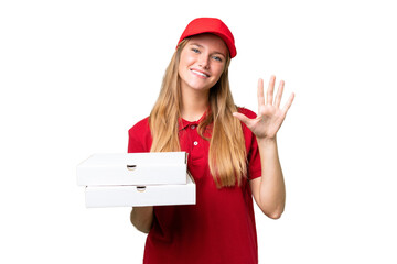 Young caucasian pizza delivery woman with work uniform picking up pizza boxes over isolated...