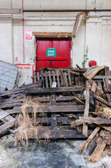 Fire exit blocked with pallets and wood