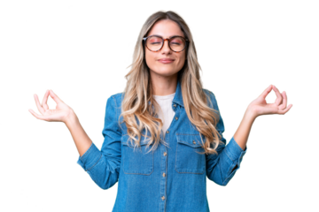 Young Uruguayan woman over isolated background in zen pose