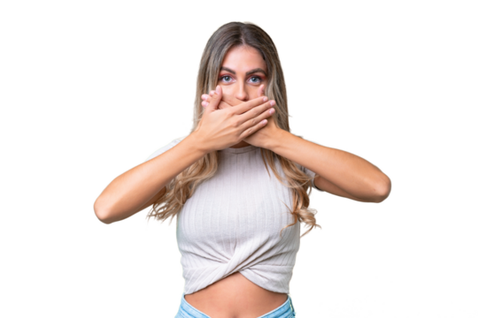 Young Uruguayan woman over isolated background covering mouth with hands