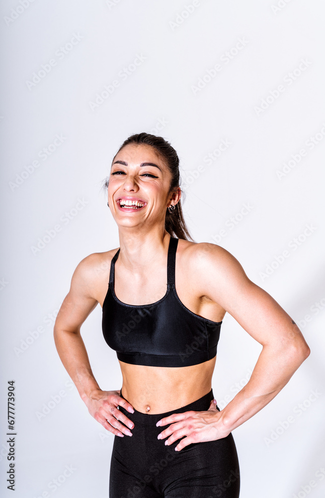 Poster Young female athlete training in a gym using sport equipment. Fit woman working out . Concept about fitness, wellness and sport preparation.