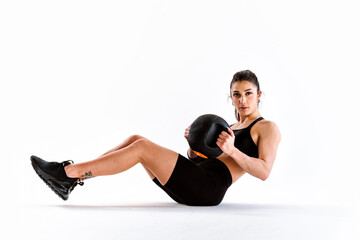 Fototapeta na wymiar Young female athlete training in a gym using sport equipment. Fit woman working out . Concept about fitness, wellness and sport preparation.