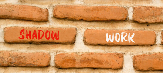 Shadow work psychology symbol. Concept words Shadow work on beautiful brown brick wall. Beautiful...