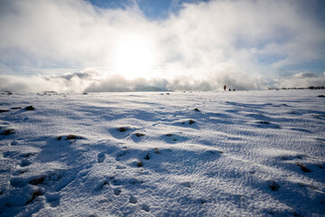 Footprints in the Arctic conditions on top of Great End in the lake district, Cumbria, England.