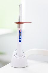 Vertical photo of a dental curing lamp or curing lamps in a room of a modern dental clinic....