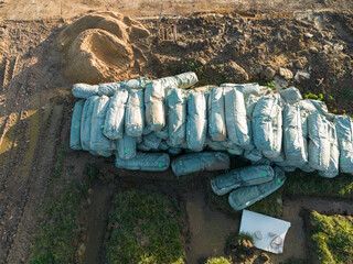 Stack of insulation material seen on a building site, ready to be put into the loft space of newly completed homes.