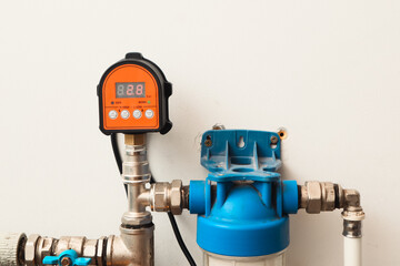 Plumbing. Installation of a new automatic control unit for the water supply pump in the house....