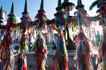 View of hundreds of souvenir ribbons tied to an iron railing in Largo Terreiro de Jesus,...