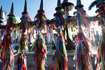 Fototapeta premium View of hundreds of souvenir ribbons tied to an iron railing in Largo Terreiro de Jesus, Pelourinho, historic center of the city of Salvador, Bahia.