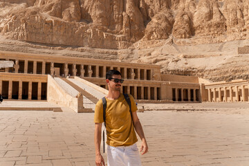 young man visits Hatshepsut temple in Luxor. Egypt