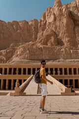 young man visits Hatshepsut temple in Luxor. Egypt