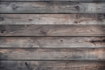 Captivating texture of aged, dry, and rough dark wooden boards, exhibiting a blend of gray and brown shades. Ideal as a wood background wallpaper.