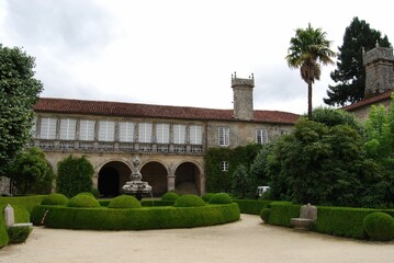 Fototapeta na wymiar Beautiful view of green historical garden Pazo de Oca with plants and trees in Spain