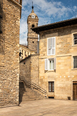 Tower with clock of the church of San Vicente Martir, 15th-16th century in Gothic and Renaissance style, among the stone houses of the old town, Vitoria-Gasteiz, Alava, Basque Country, Spain