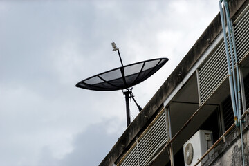 Satellite dish on blue sky .