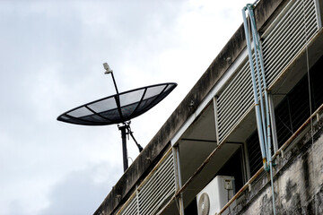 Satellite dish on blue sky .