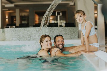 Family in the indoor swimming pool