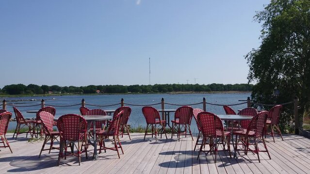 Panorama of the terrace with tables on the seashore