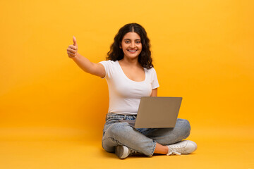Happy Young Indian Woman Using Laptop Computer Gesturing Thumb Up