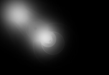 abstract lens flare light over black background