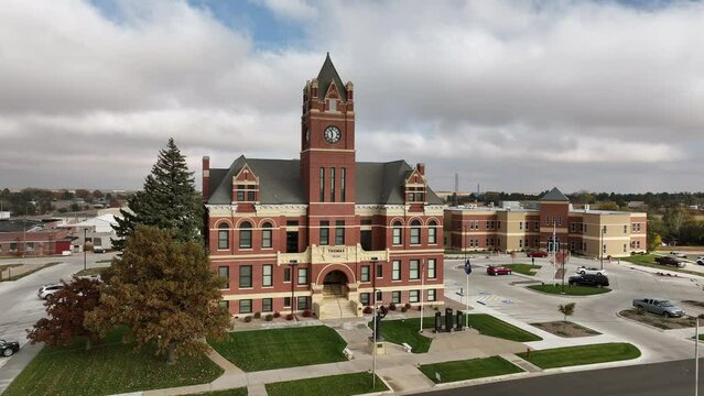 Aerial view over Colby Kansas viewing the City Courthouse, slowly circling around it.