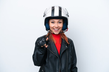 Young Russian girl with a motorcycle helmet isolated on white background surprised and pointing front
