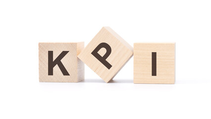 three wooden cubes with the letters KPI on white table. Key Performance Indicators concept