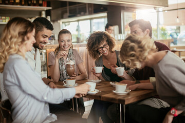 Group of Happy friends having coffee together in cafe or bar