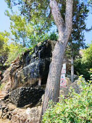 Small cascade with a tank outside the Kallithea Springs, Rhodes Island, Greece.