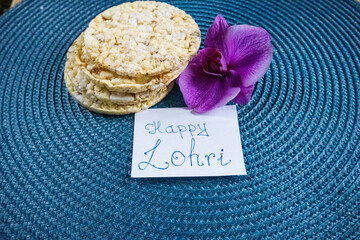 happy lohri festive celebration with food and nuts. Festivals of India