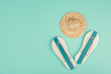 Summer vacation by the sea, flip flops and a straw hat, travel and tourism concept